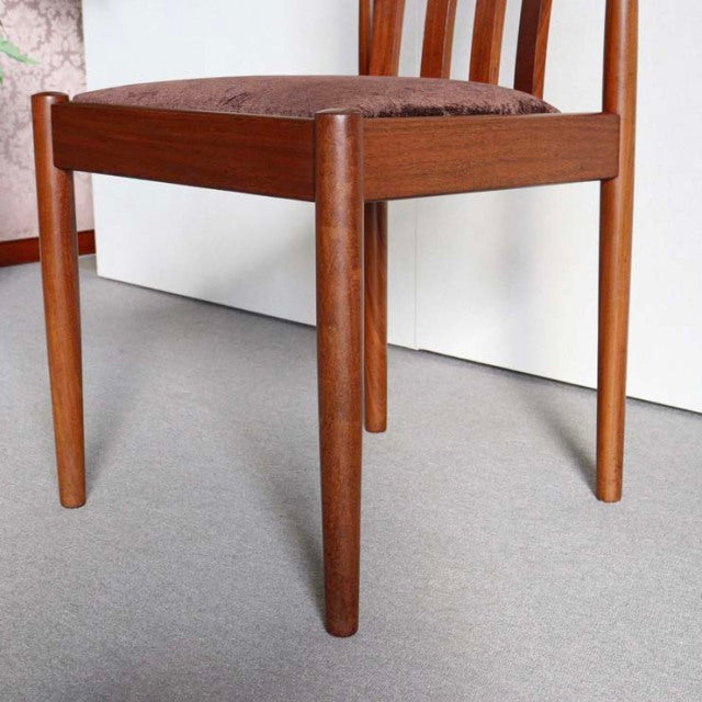 Vintage mid-century Meredew teak dining chair from Denmark with tapered round legs and visible wood grain.