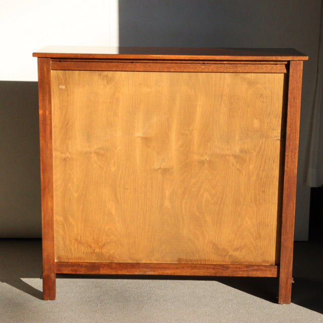 Vintage teak cabinet by British Jaycee with mid-century Denmark design, smooth wood grain, and straight legs.
