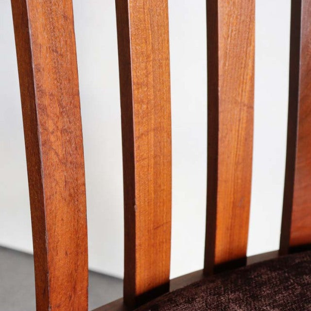 Vintage Meredew British mid-century teak dining chair with vertical slat back and dark brown upholstered seat from Denmark.