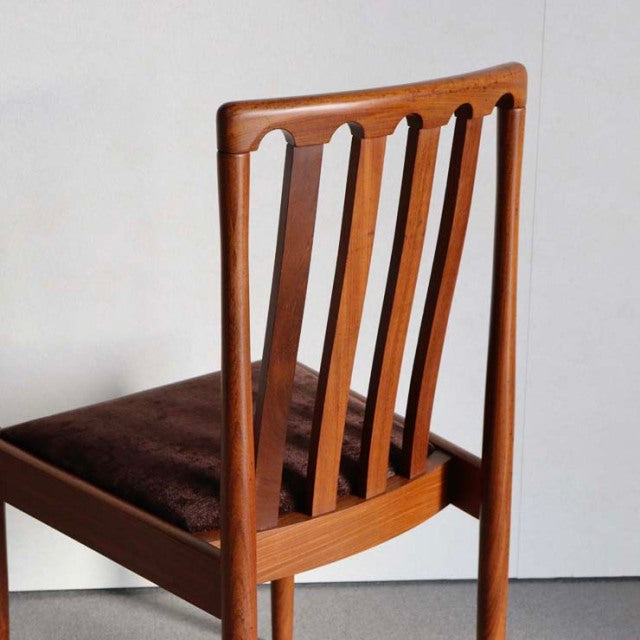 Mid-century British vintage Meredew teak dining chair with vertical slat back and dark upholstered seat.
