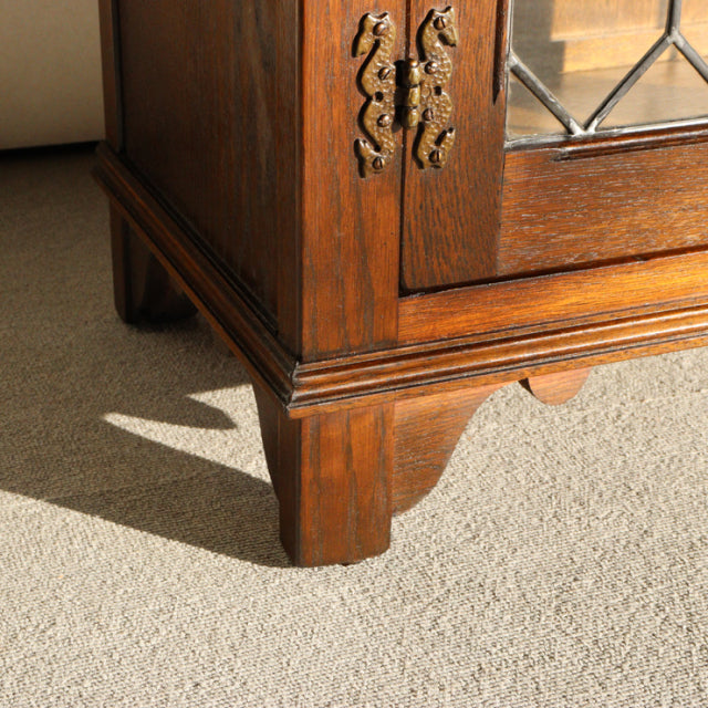 Mid-century teak Jaycee cabinet corner with carved British vintage brass hardware and visible wood grain from Denmark.
