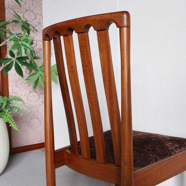 Mid-century vintage Meredew teak dining chair from Britain with vertical slatted back and warm wood grain.