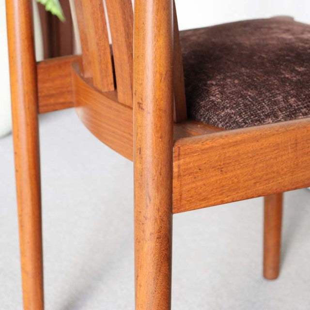 Mid-century British Meredew teak dining chair with curved wooden legs and rich brown upholstered seat.