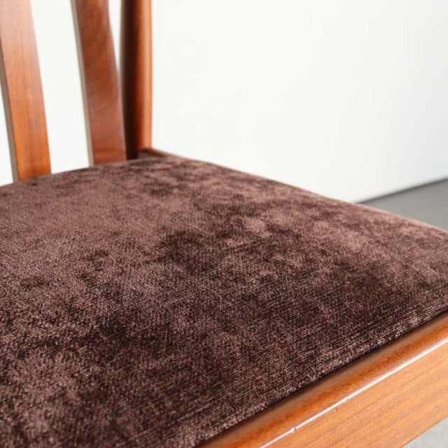 Mid-century teak dining chair by Meredew with British-Danish vintage style, plush brown fabric seat, and warm wood grain.