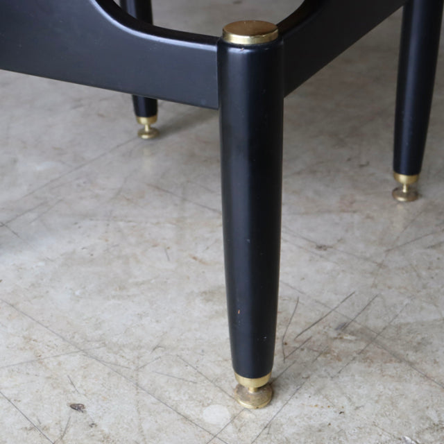 Black tapered wooden leg with brass cap and mid-century teak grain detailing on British vintage G-Plan bedside cabinet.