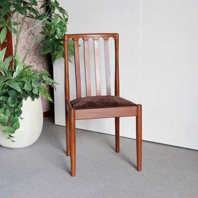 Vintage Meredew teak dining chair from mid-century British Denmark design, featuring vertical slats and brown upholstered.