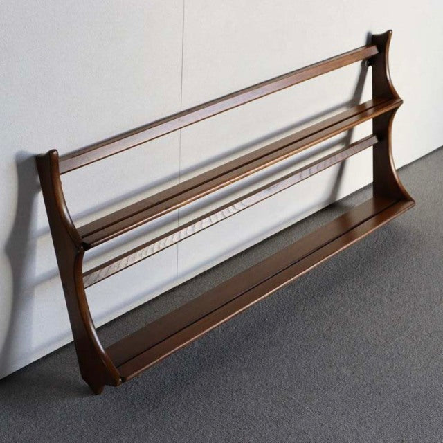 Vintage mid-century Ercol teak wall-mounted plate rack with sleek arched sides and visible wood grain from British-Danish.
