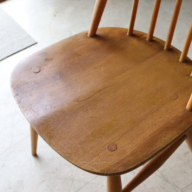 Vintage British Ercol Quaker chair seat in natural teak with smooth wood grain and rounded edges, mid-century design from.
