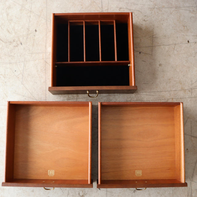 Mid-century vintage teak drawer interiors with divided compartments and smooth wood grain from British G-Plan sideboard.