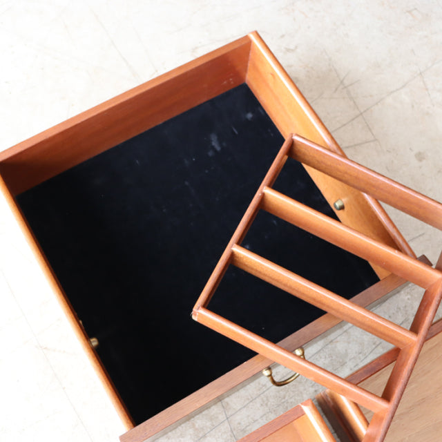 Vintage teak G-Plan mid-century British sideboard drawer with visible wood grain and brass knob.