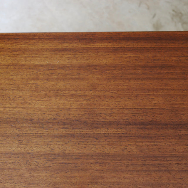Smooth teak wood grain surface of British mid-century G-Plan sideboard with warm vintage finish.
