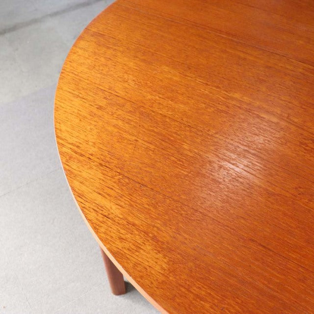 Vintage teak dining table top with smooth grain, rounded edge, British mid-century design from Denmark.