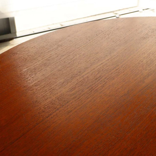 Oval vintage teak dining table top with rich wood grain, mid-century British design from Denmark.