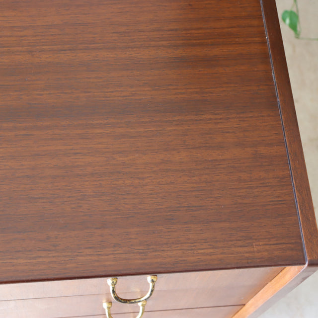 Vintage British mid-century G-plan teak chest top with smooth wood grain and precise edges.