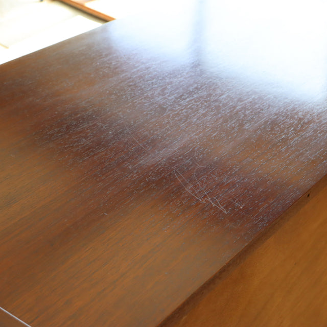 Vintage British mid-century G-Plan teak sideboard top showing rich wood grain and smooth finish.