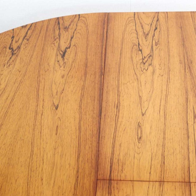 Vintage teak round dining table top with distinct mid-century British wood grain pattern.