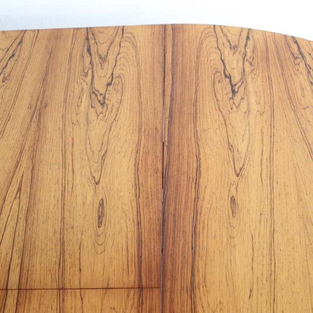 Round vintage teak dining table top with distinctive wood grain and mid-century British craftsmanship from McIntosh.
