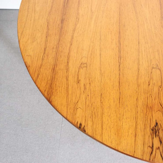 Round mid-century teak dining table top with fine wood grain, British vintage style, smooth finish.