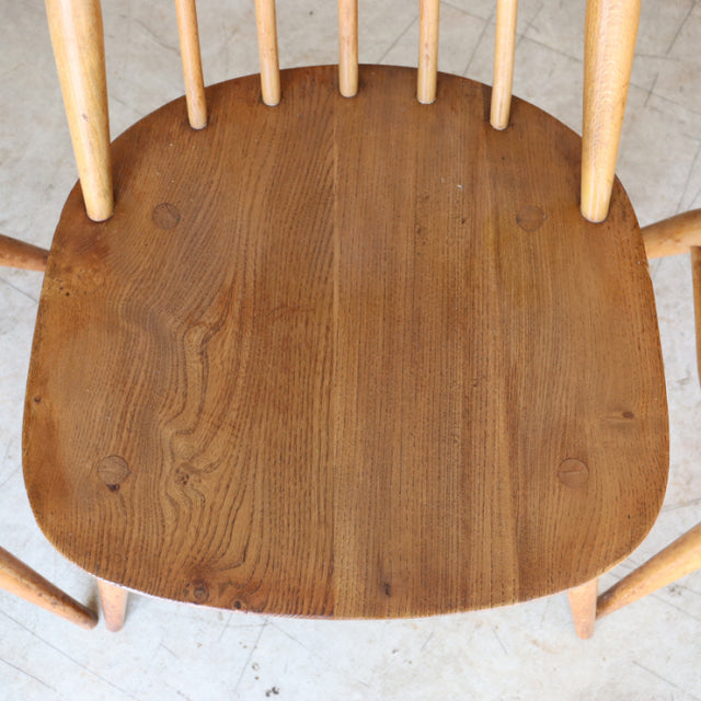 Vintage British Ercol Goldsmith teak chair seat with smooth wood grain and natural finish, mid-century style.