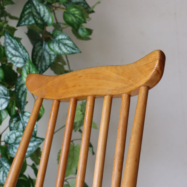 Set of four vintage Ercol Goldsmith high-back dining chairs in natural teak with smooth curved top rails and slender spindle .