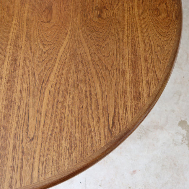 Vintage British mid-century G-Plan teak dining table with rich wood grain and smooth rounded edge.