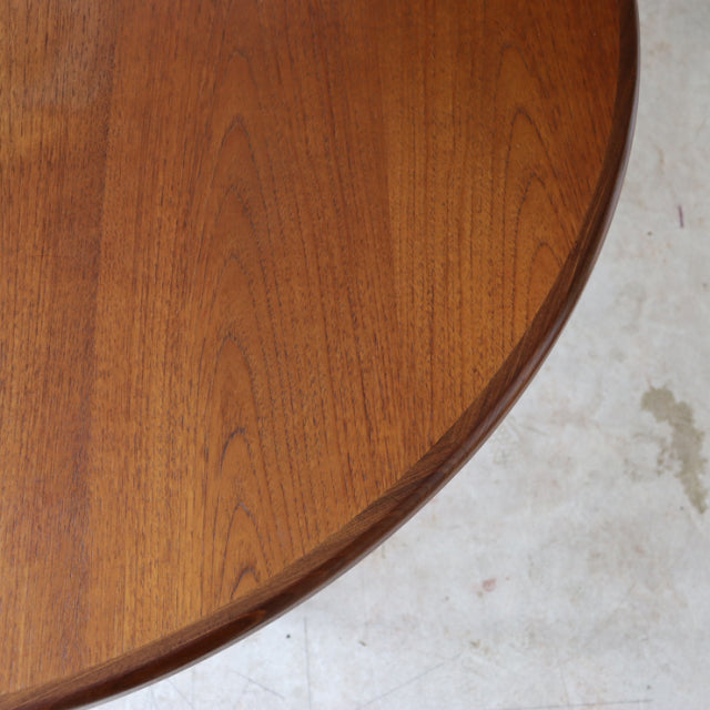 Round vintage teak dining table top by G-Plan showcasing rich wood grain and smooth mid-century British craftsmanship.