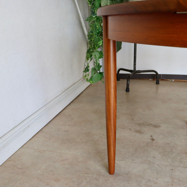 Mid-century vintage G-Plan teak dining table leg with tapered design and visible wood grain, British Denmark style.