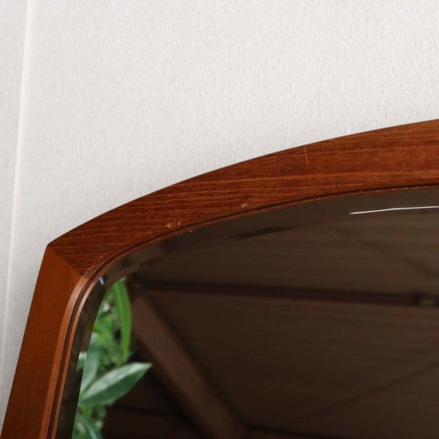 Vintage mid-century teak wall mirror from Denmark with smooth rounded edges and visible wood grain.