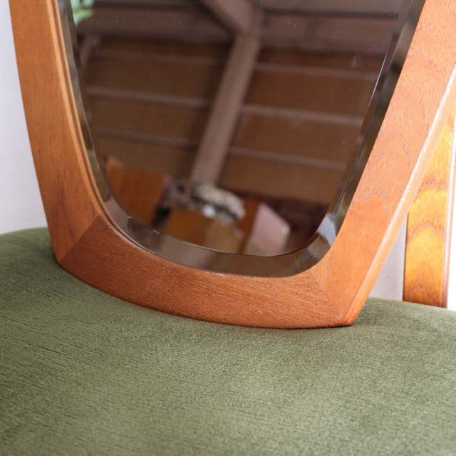 Vintage mid-century teak mirror with smooth rounded edges, embodying Danish and British design influences.