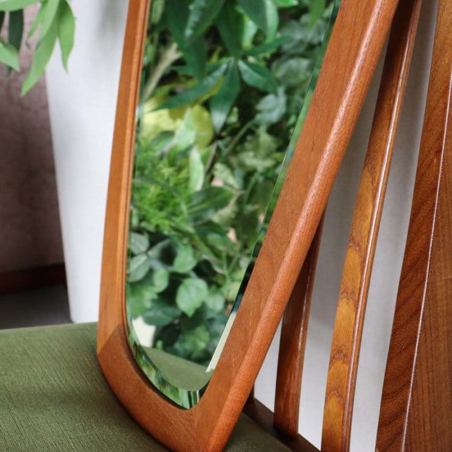 Mid-century vintage teak wall mirror with smooth rounded edges and warm wood grain, Danish design.