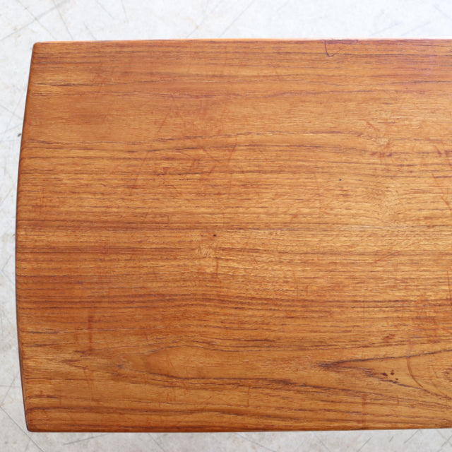 Vintage mid-century teak coffee table top with warm wood grain, British-Danish style, smooth finish.