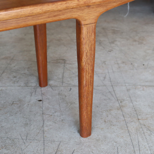 Mid-century vintage teak coffee table leg with smooth wood grain and rounded tapered design, British-Denmark style.