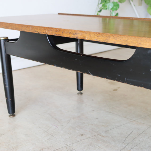 Mid-century vintage teak and black metal G-Plan coffee table with visible wood grain and tapered legs, British design with.