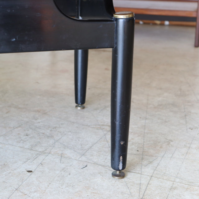 Mid-century British G-Plan teak coffee table leg with black finish and brass-capped tapered design showing wood grain and.