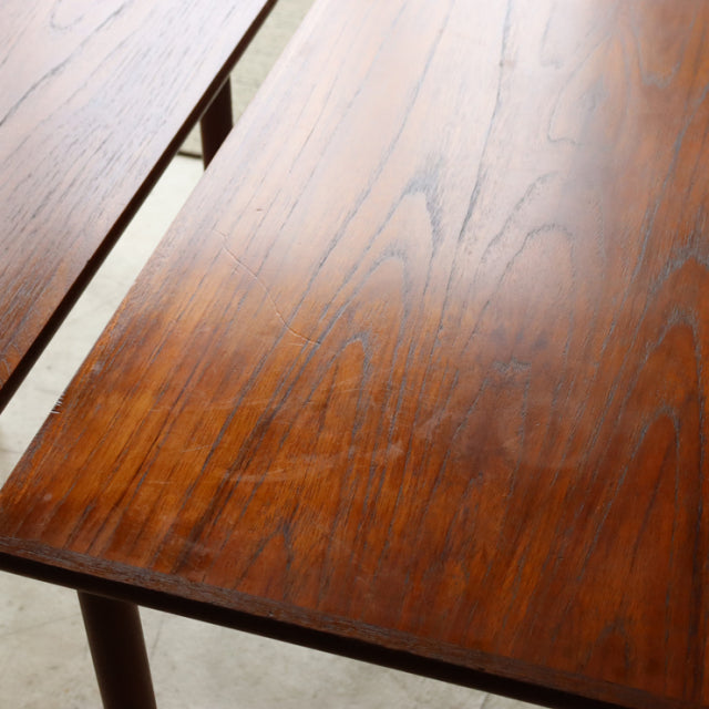 Vintage mid-century Danish teak nest tables with rich wood grain and slender tapered legs.