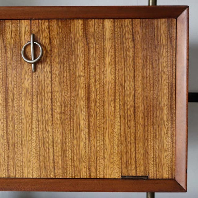 Vintage teak mid-century British room divider with iron legs and vertical wood grain pattern.