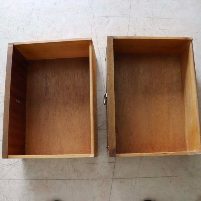 Pair of vintage teak drawers with rich wood grain, showcasing mid-century British-Danish design and clean lines.