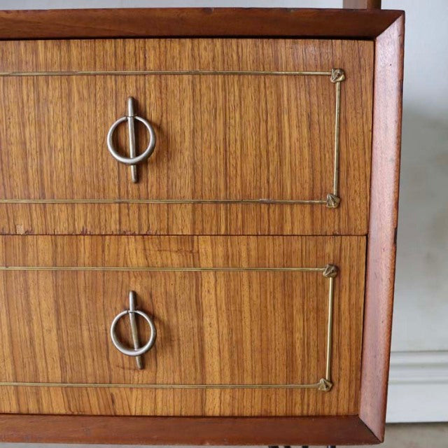 Vintage mid-century teak room divider with British-Denmark style, detailed wood grain, and iron ring handles on warm-toned.