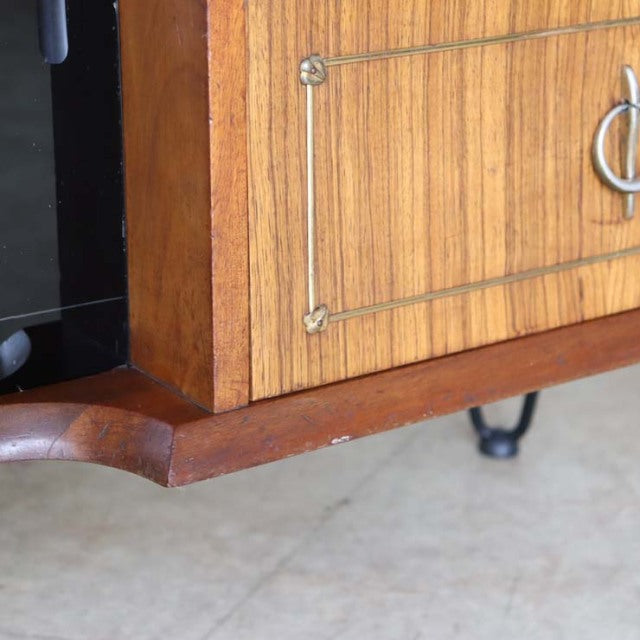 Vintage teak mid-century room divider with British design, brass hardware, and iron legs from Denmark.
