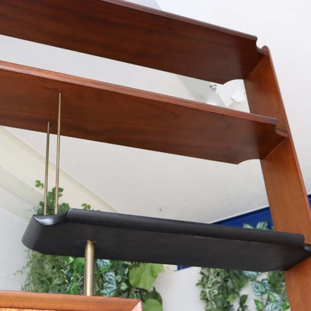 Mid-century vintage teak room divider with British iron legs and rich wood grain finish, Danish design influence visible.
