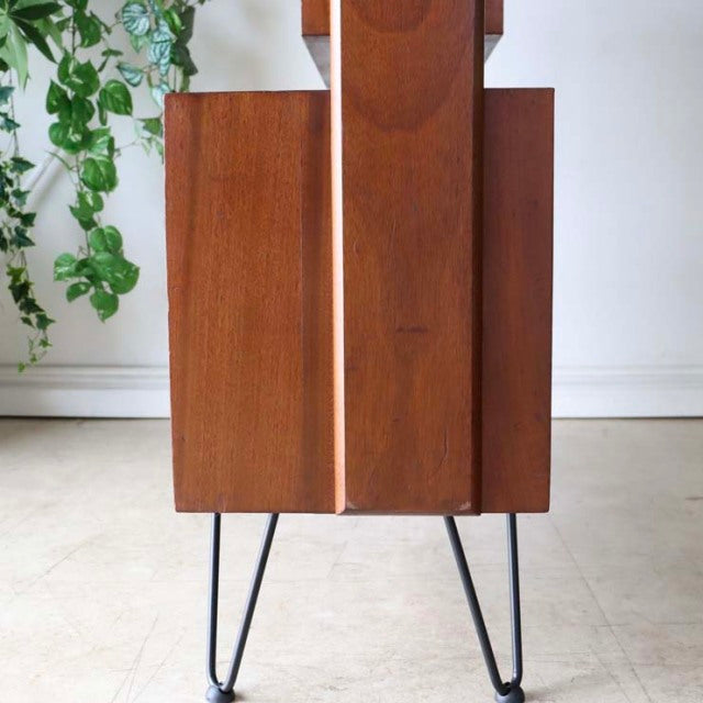 Vintage teak mid-century room divider with British design, featuring iron hairpin legs and rich wood grain from Denmark.