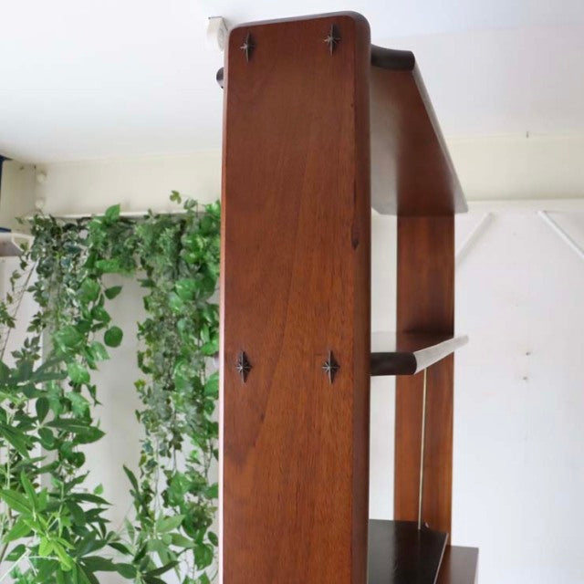 Mid-century British vintage teak room divider with iron legs, showcasing rich wood grain and sleek Danish-inspired design.