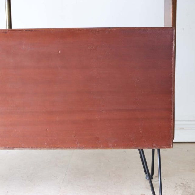 Vintage teak room divider with rich wood grain, British mid-century style, iron legs in Denmark design.