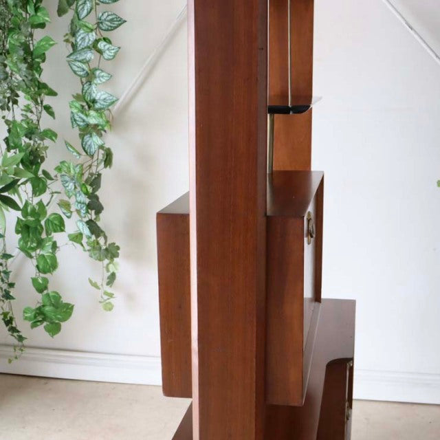 Mid-century vintage teak room divider with British design, iron legs, and rich wood grain.