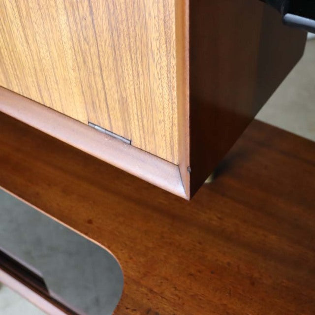 Vintage mid-century teak room divider with British design, smooth wood grain and iron legs from Denmark.