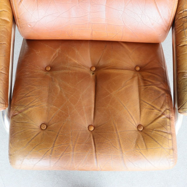 Vintage British mid-century sofa seat cushion in aged teak leather with button tufting and natural creases.