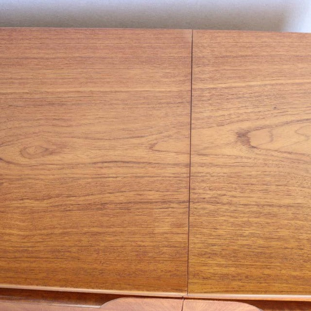 Vintage teak wood sideboard top with rich grain detail from mid-century British-Denmark design.