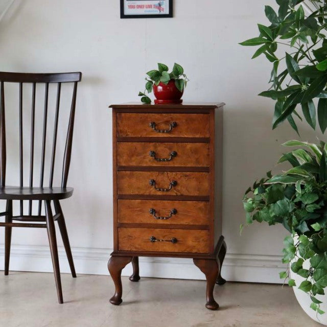 Vintage British walnut record cabinet with rich wood grain, four drawers, and carved mid-century Queen Anne legs.