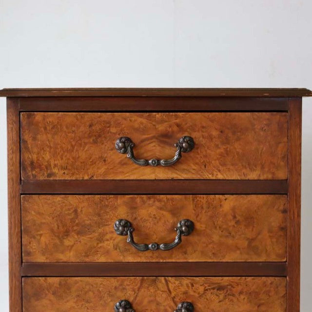Vintage British teak record cabinet with rich wood grain, ornate brass handles, and mid-century design.