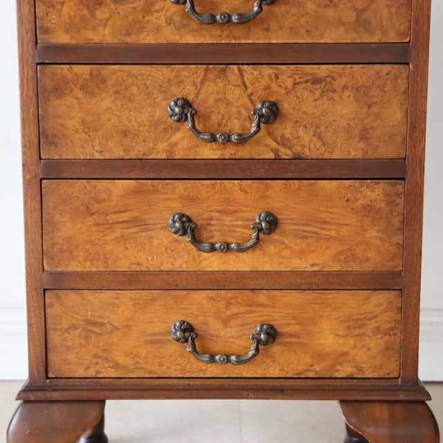 Vintage British walnut record cabinet with rich wood grain, ornate metal handles, and sturdy carved legs.